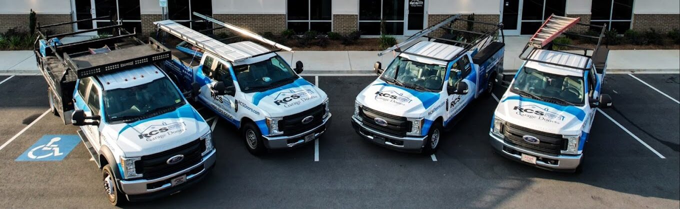 RCS Garage Doors service trucks in front of the company headquarters